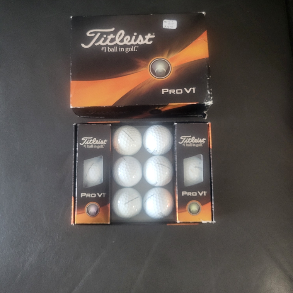 Titleist Pro V1 Golf Balls in Black and Orange Packaging